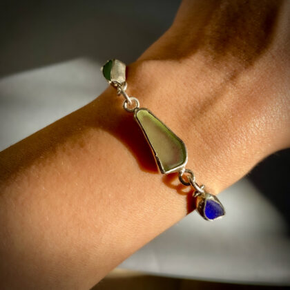 Unique handmade sea glass bracelet crafted from authentic Tunisian beach glass and sterling silver with adjustable chain closure.