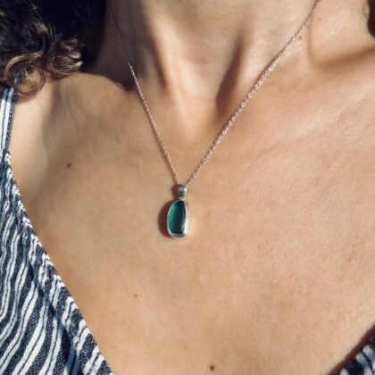 One-of-a-kind teal green sea glass pendant set in sterling silver, handcrafted in Tunisia using authentic Mediterranean sea glass.